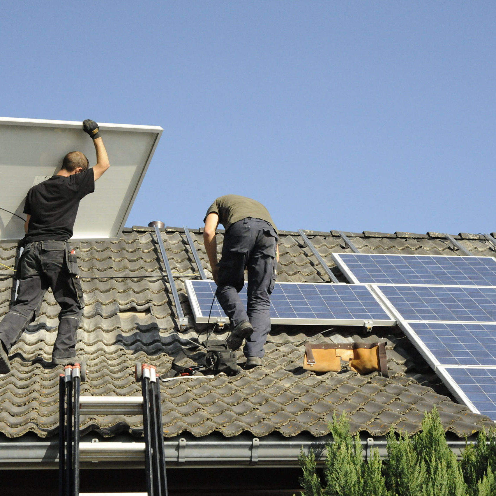 Workers installing a solar system